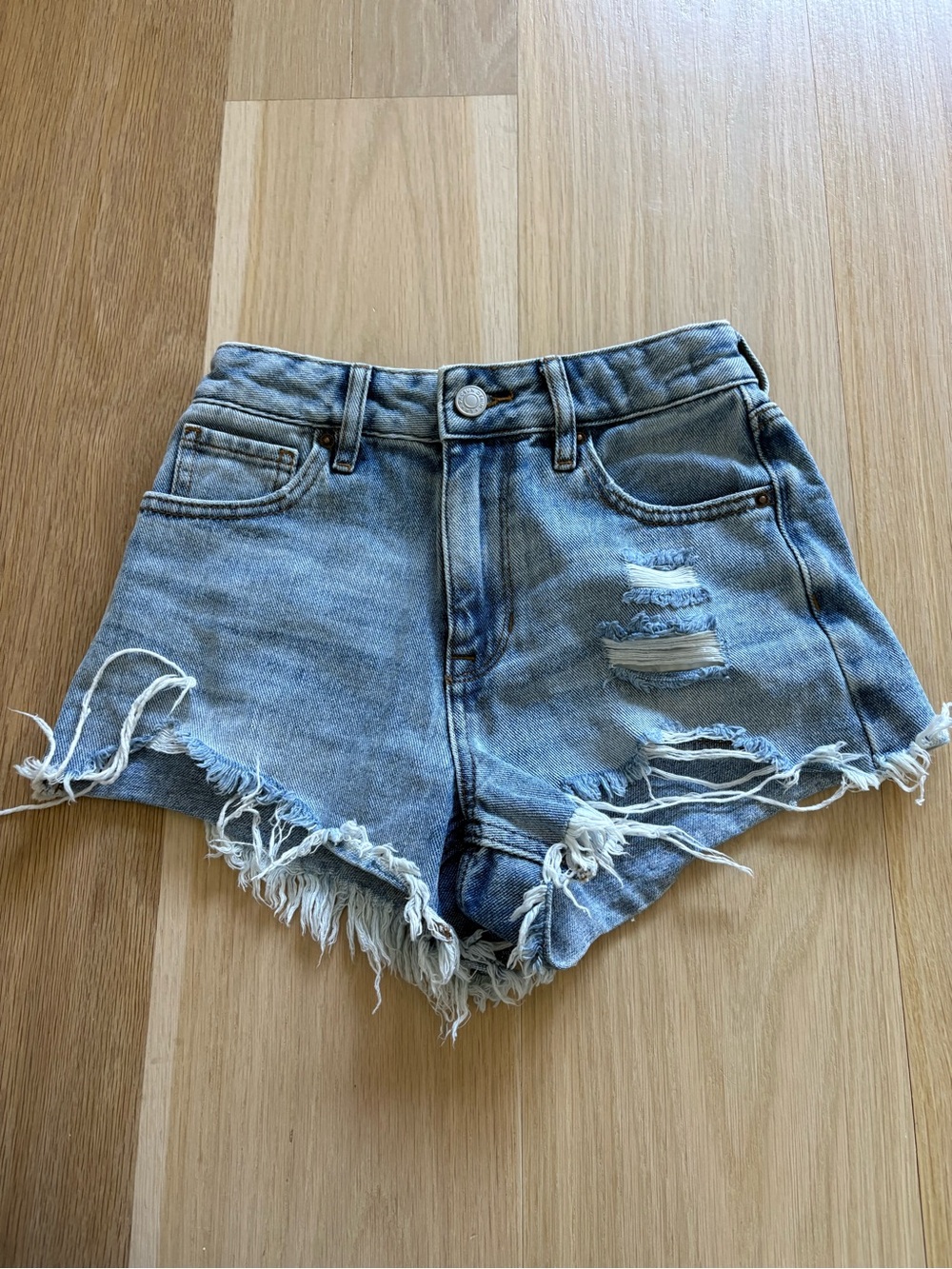 High-Rise Light Blue Distressed Denim Shorts